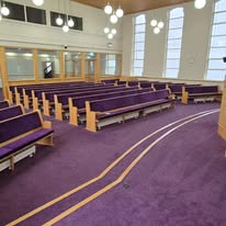 Purple carpet between the pews of a church