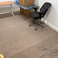 Office carpet beside a desk and chair