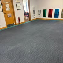 A large carpeted room from JR’s low-moisture cleaning work
